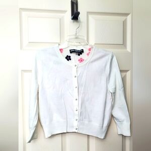 Karl Langerfield White crop Sweater with patterned lining & pearl shaped buttons